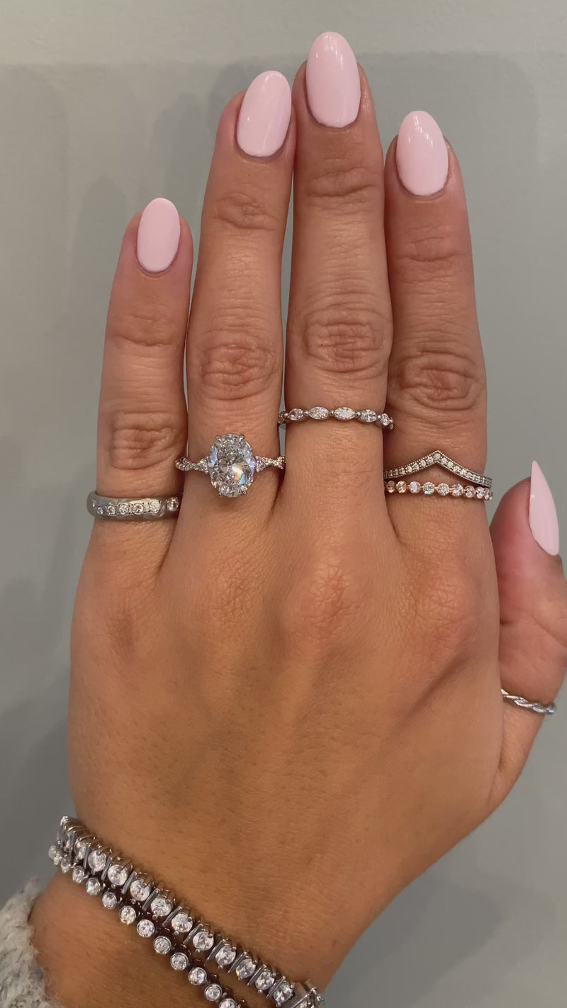 caption:Shown with 2.2ct oval diamond in platinum 