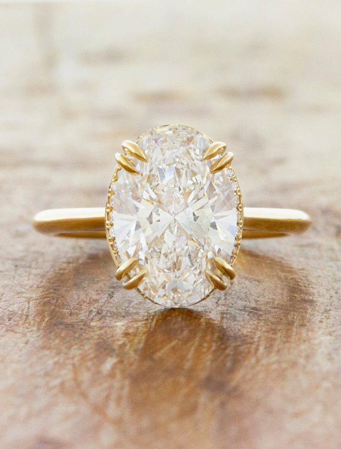 caption:Shown with 3ct oval diamond customized with non-leaf double claw prongs in 14k yellow gold 