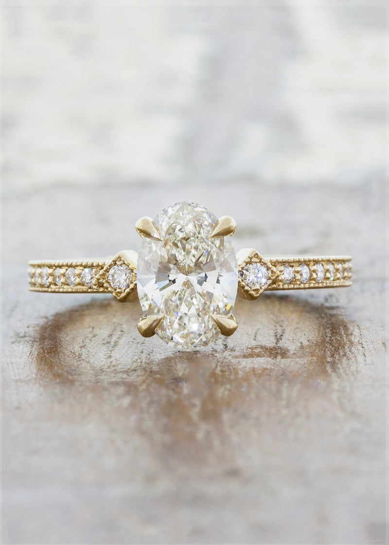 caption:Customized with a vertically set 0.90ct oval diamond in 14k yellow gold 