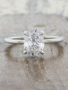 caption:Shown with a 1.51ct oval diamond in platinum