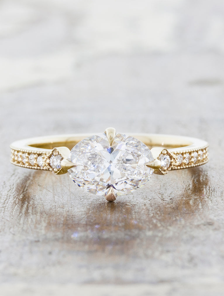 caption:Shown with 1.20ct oval diamond in 14k yellow gold