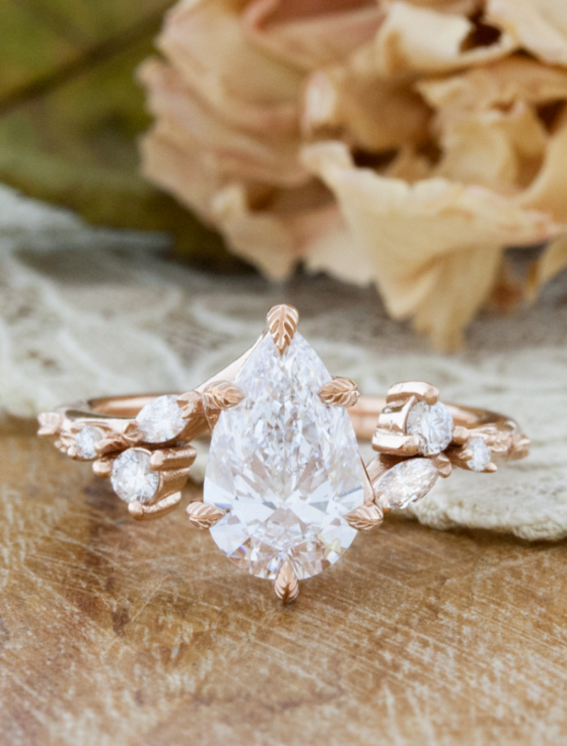 caption:Harmony engagement ring shown with 1ct pear diamond